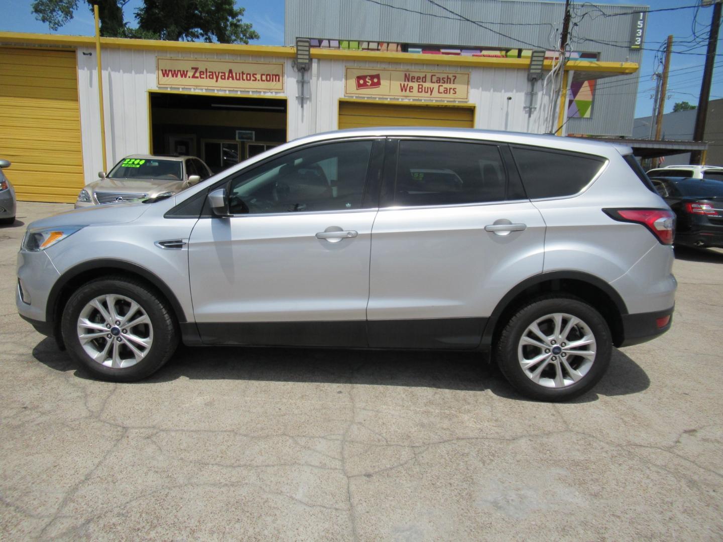 2017 Silver /Black Ford Escape SE FWD (1FMCU0GDXHU) with an 1.5L L4 DOHC 16V engine, Automatic transmission, located at 1511 North Shepherd Dr., Houston, TX, 77008, (281) 657-1221, 29.798361, -95.412560 - 2017 FORD ESCAPE SE VIN: 1FMCU0GDXHUE54105 1 F M C U 0 G D X H U E 5 4 1 0 5 4 DOOR WAGON/SPORT UTILITY 1.5L I4 F DOHC 16V GASOLINE FRONT WHEEL DRIVE - Photo#0